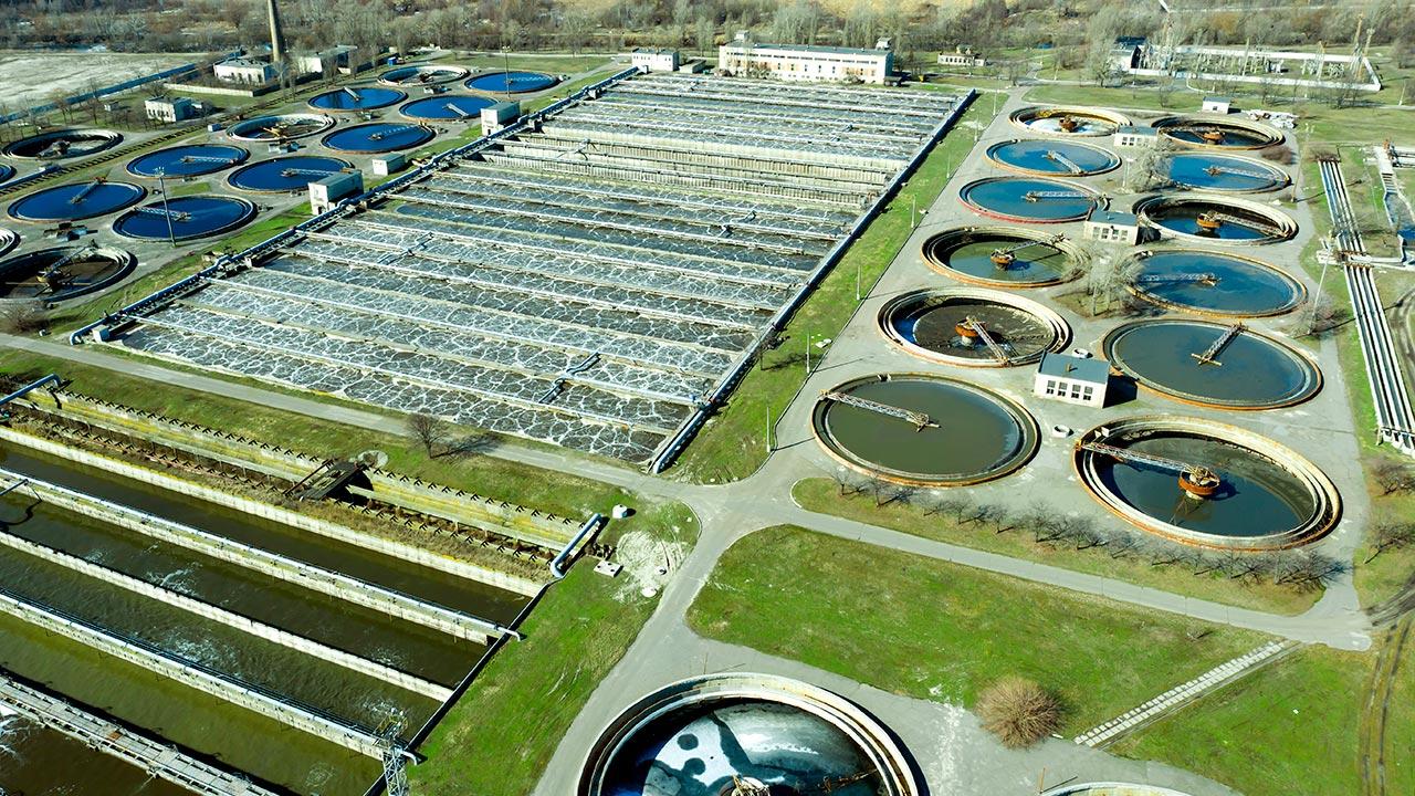 Aerial view at night of wastewater treatment plant, filtration of dirty or sewage water